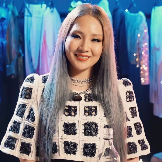 CL WEARING HOLY MOUNTAIN CROSS CROCHET TOP